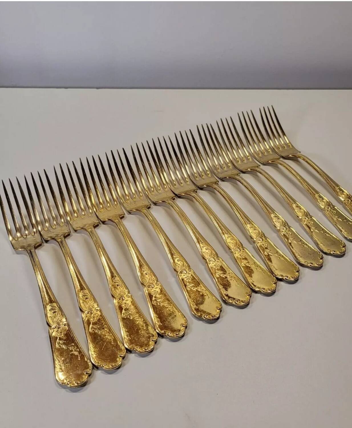 12 Table Forks in gold metal
