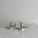 Pair of shiny silver metal candlesticks