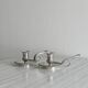 Pair of shiny silver metal candlesticks