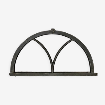 Old arched anthracite grey window