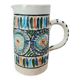 Old pitcher in Tunisian earthenware with colourful decoration.