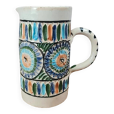 Old pitcher in Tunisian earthenware with colourful decoration.