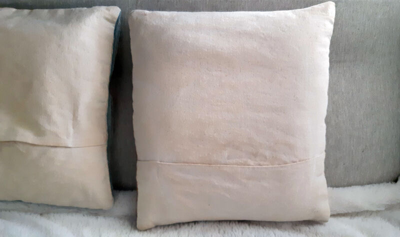 Set of three old hand-embroidered wool cushions