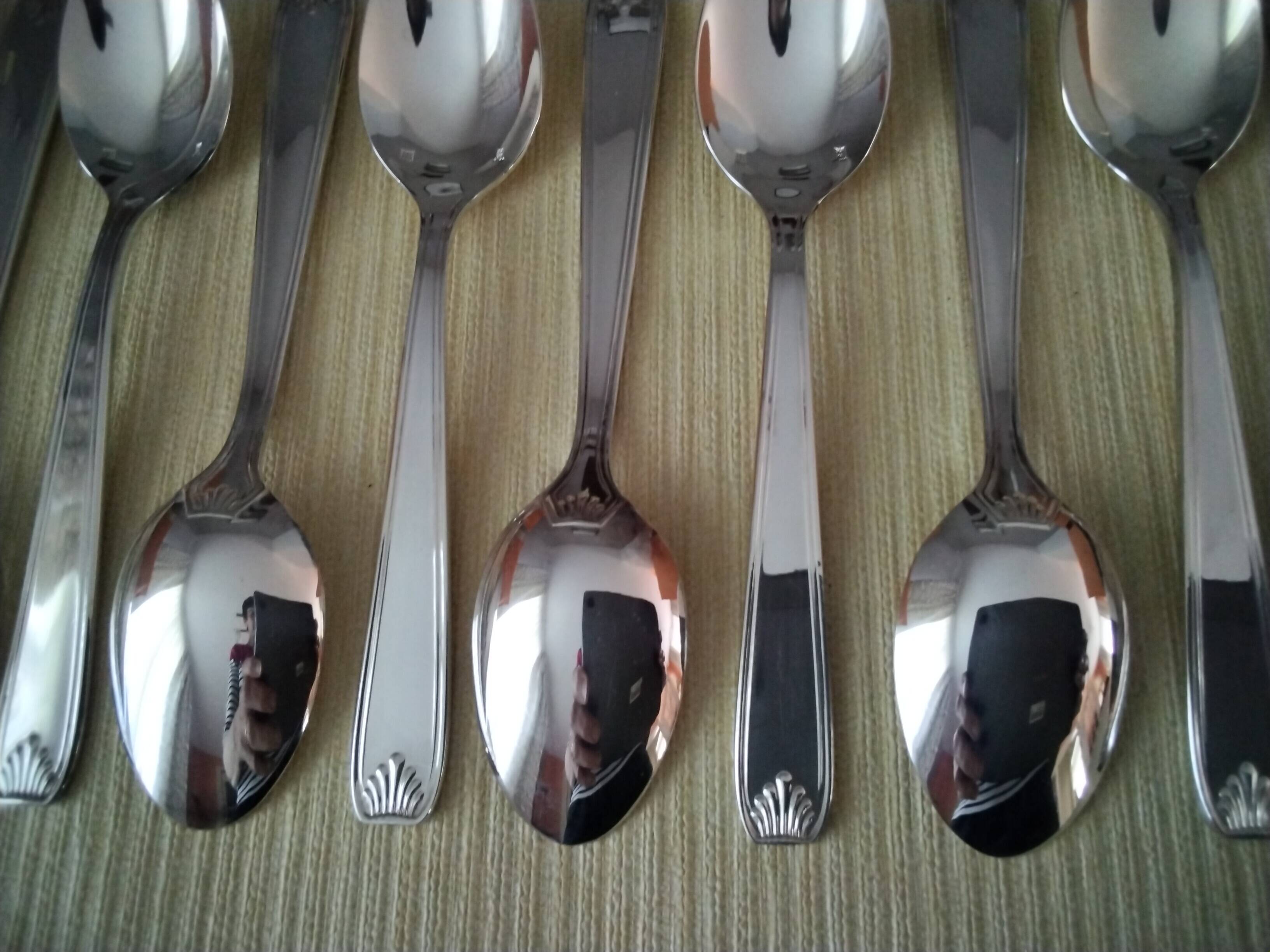 Set of 12 silver-plated coffee spoons in "shell" design.