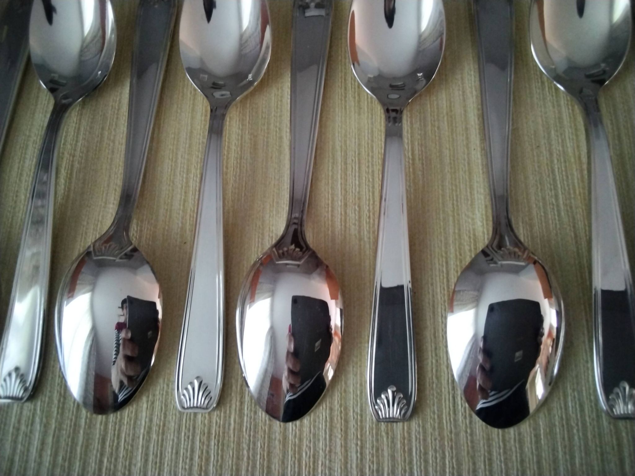 Set of 12 silver-plated coffee spoons in "shell" design.