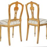 Pair of Louis XVI style chairs in gilded wood.