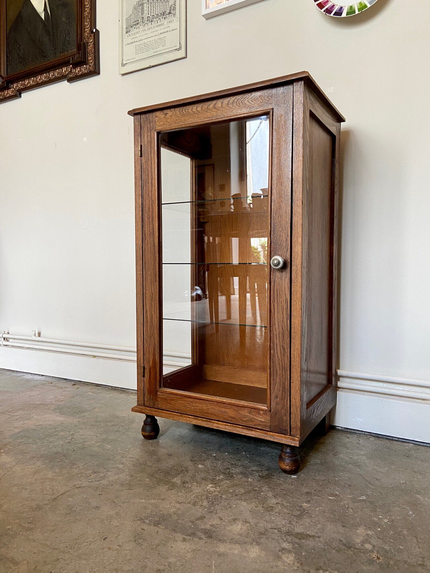 Dark wood display case and transparent glass