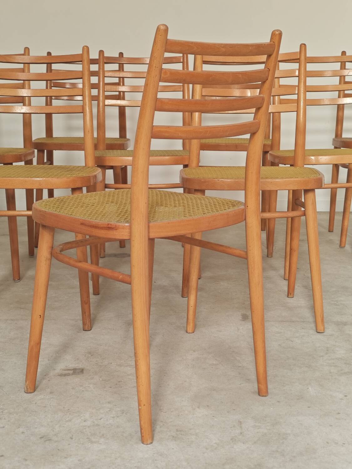 Set of 10 Bystrice tone wooden and caned chairs from the 1960s.
