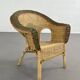 Cabriolet style armchair in rattan, wicker and green and red edging