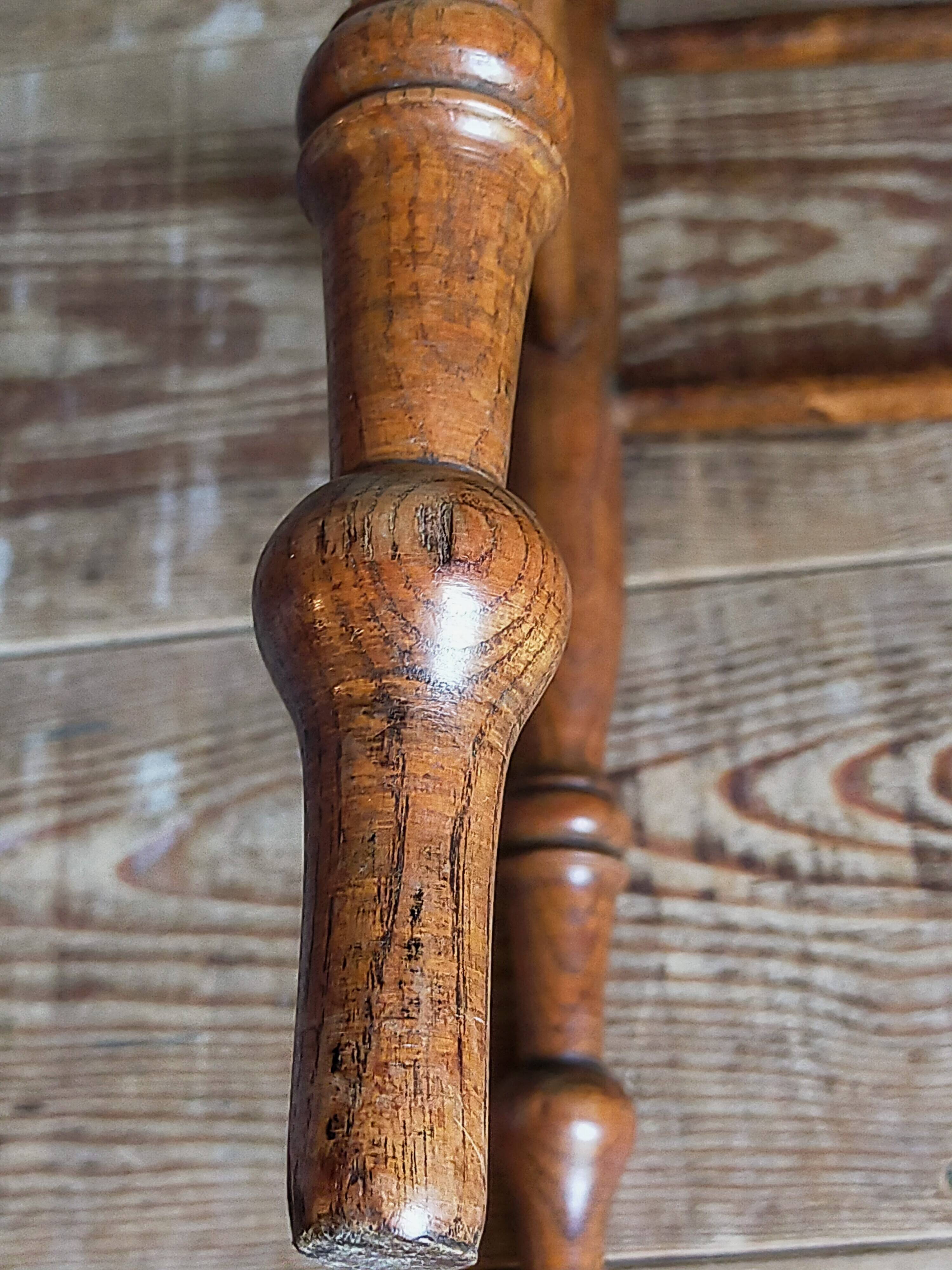 Antique stool with cane and turned wood