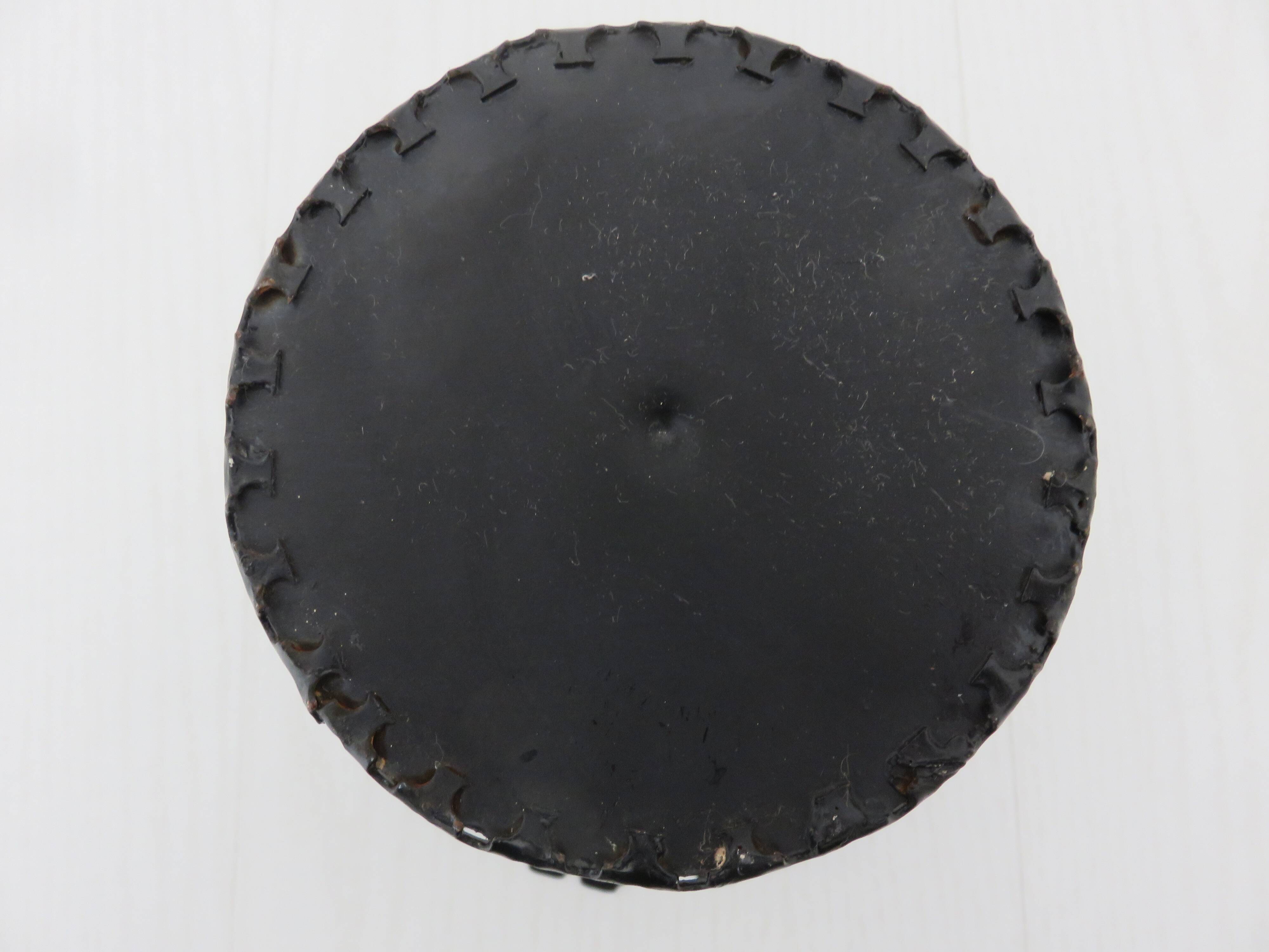 Perforated black metal cachepot from the 1950s and 1960s.