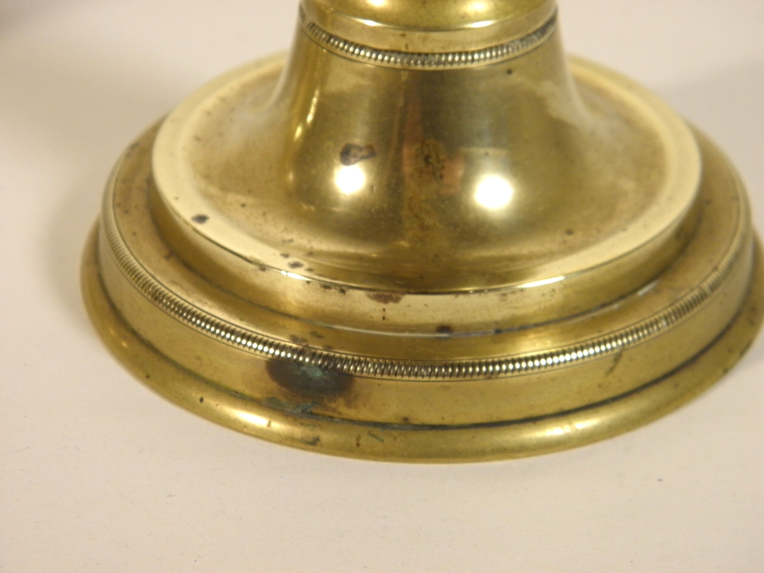 Pair of brass push candlesticks