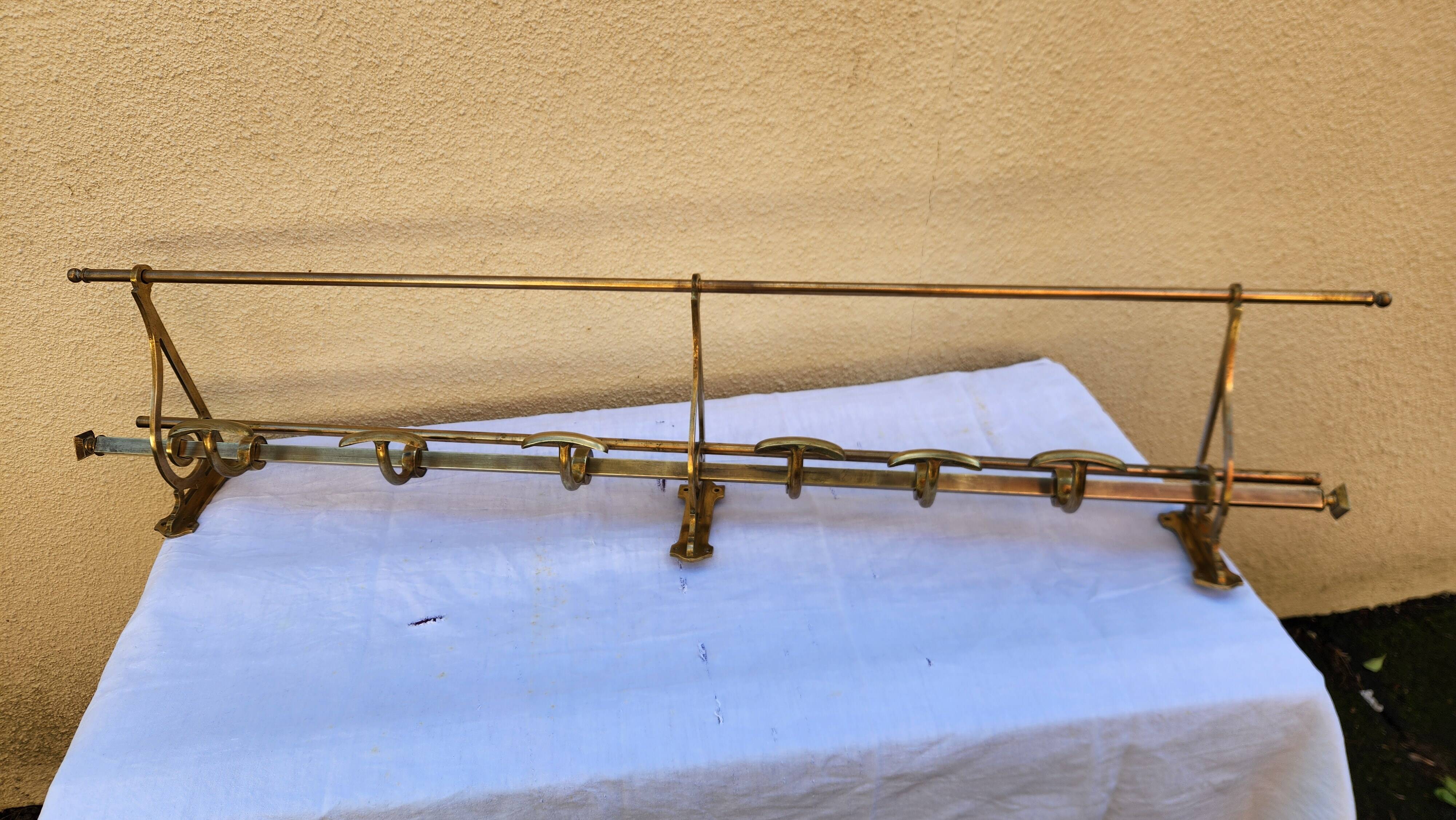 very beautiful wall-mounted coat rack wardrobe in brass from the 19th century