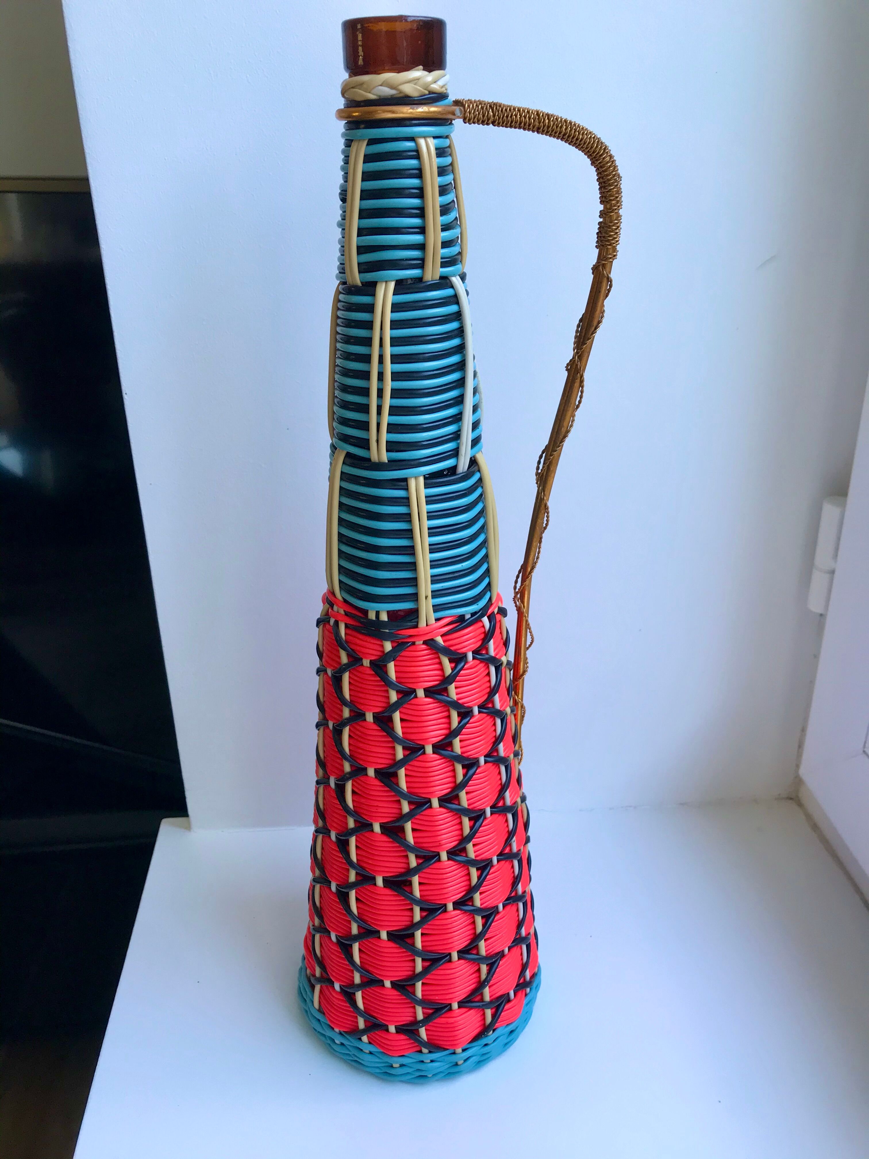 Scoubidou bottle with orange and blue and yellow brass handle 70s