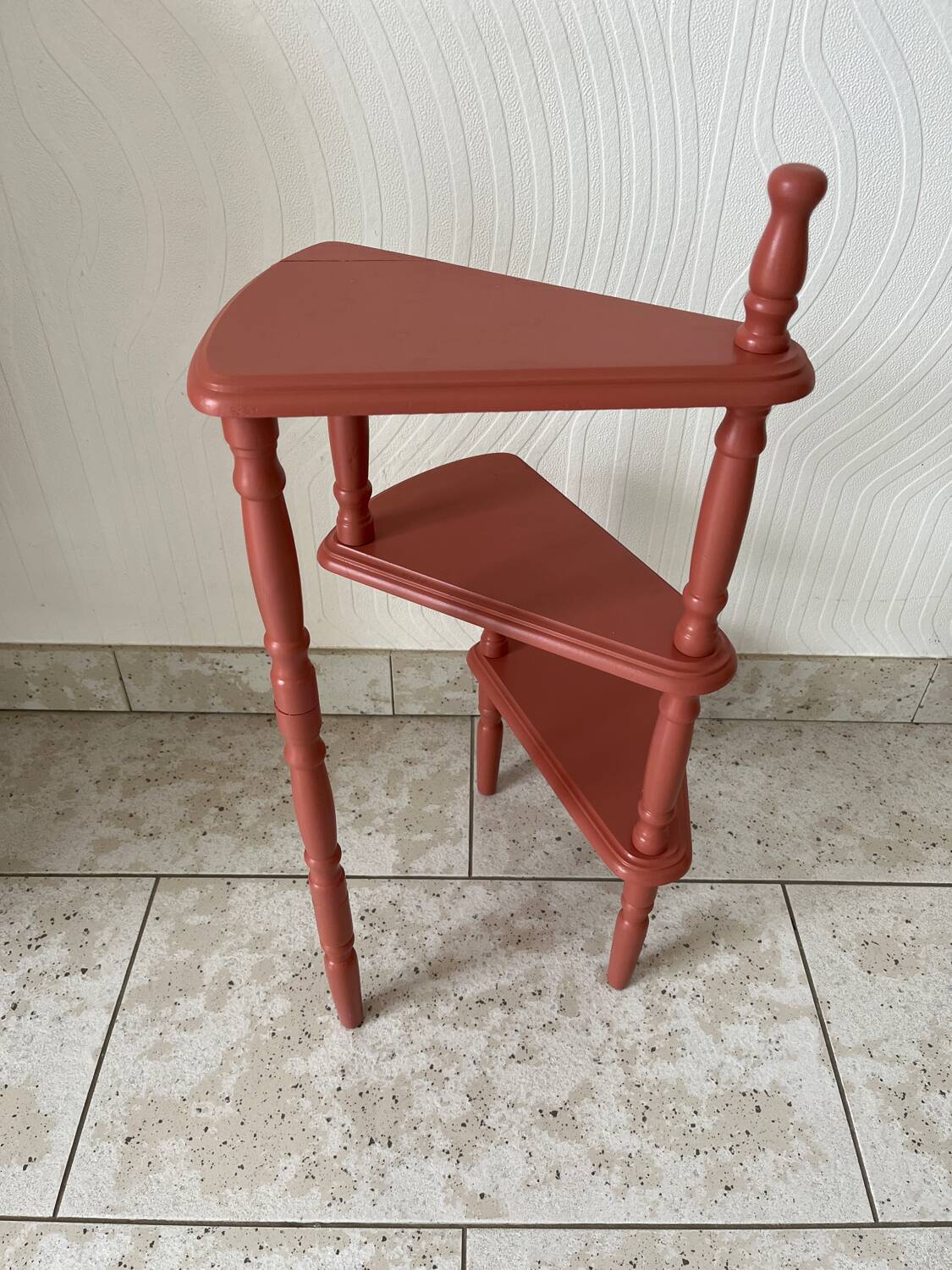 Old plant holder repainted in terracotta