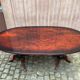 Glossy mahogany dining table in English Regency style from the 1970s.