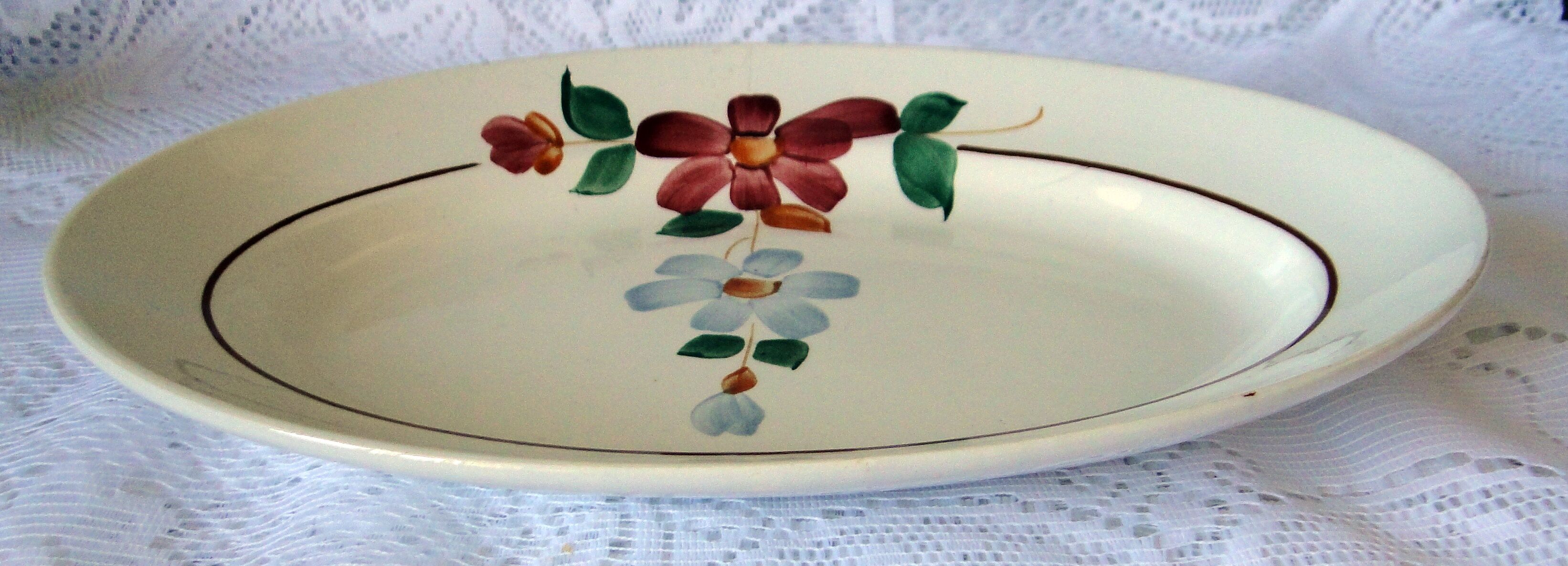 Old oval dish in faience st Amand n° 7011 flower pattern