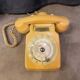 Old dial telephone from the 80s temat quimper bakelite yellow and beige