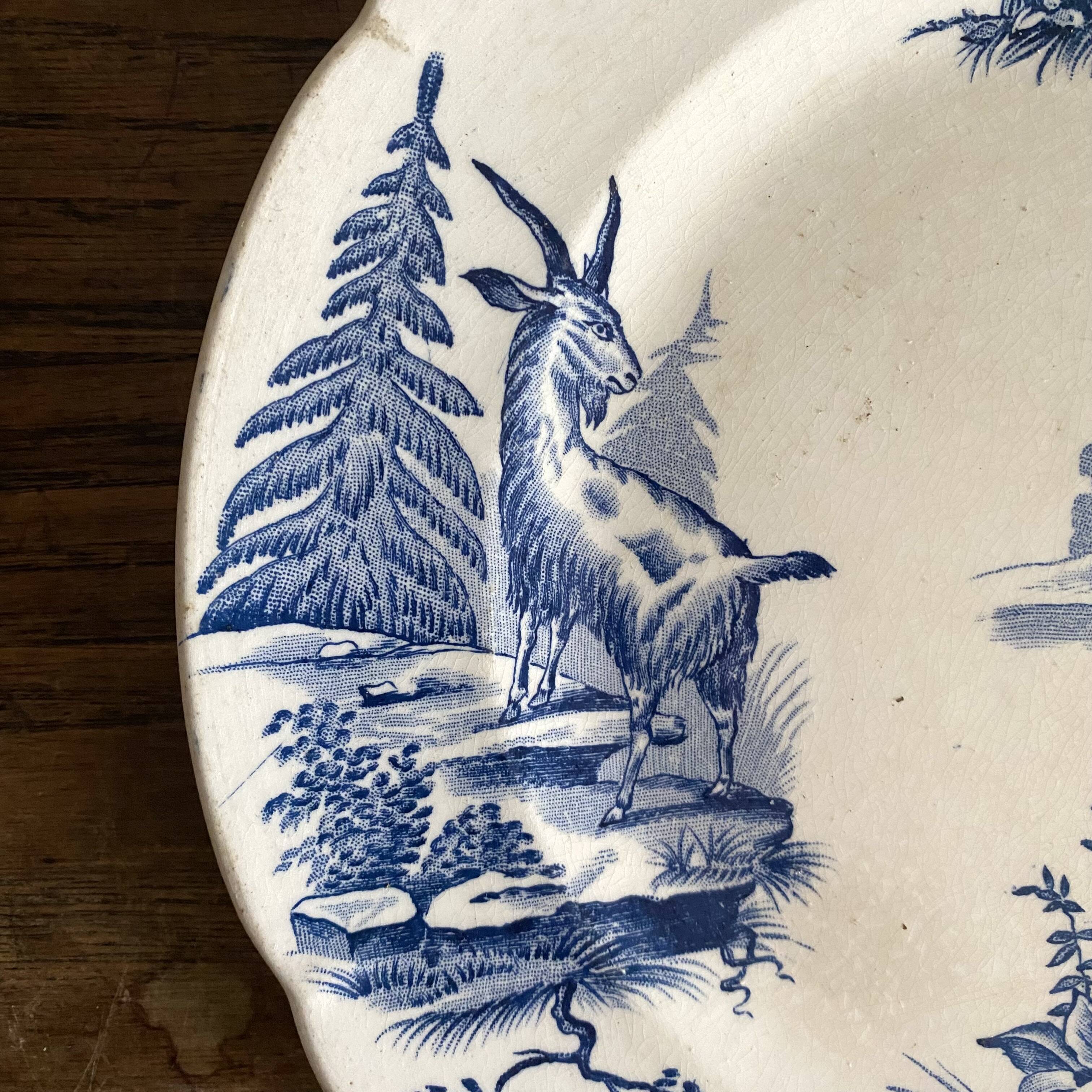 "Rustic" iron earth plate with goats