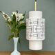 Vintage suspension globe in white opaline with black drawings.