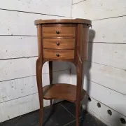 Oval bedside table in Louis XV style made of mahogany.