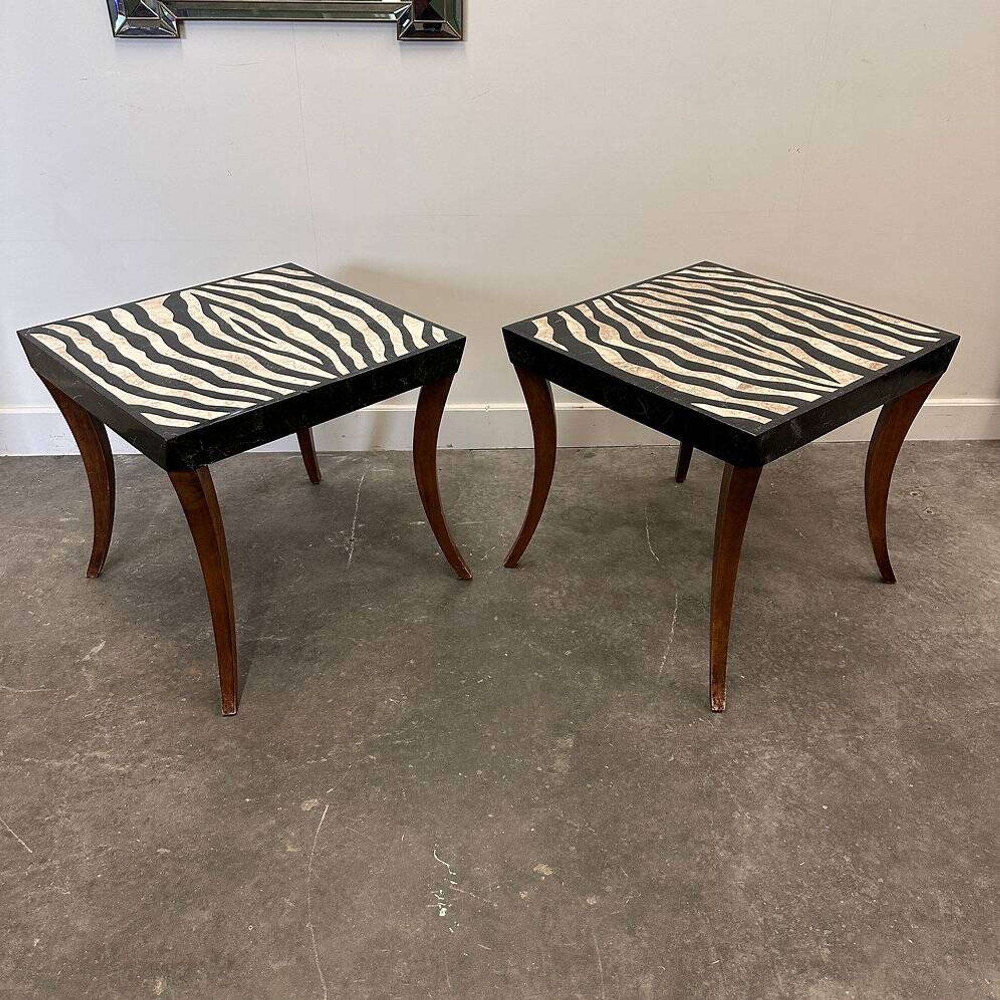 Striking pair of Italian zebra inlaid tessellated stone tables with refined curves