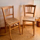 Set of 2 vintage bistro chairs in raw wood.