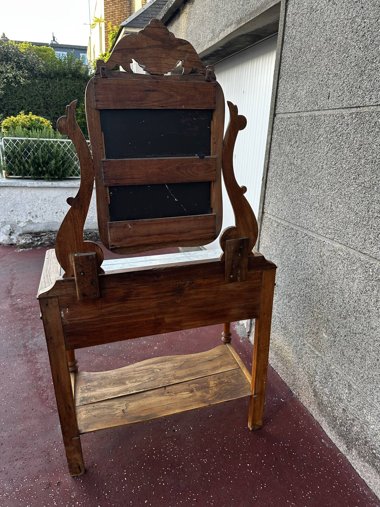 Walnut and marble dressing table, mercury mirror, circa 1850.