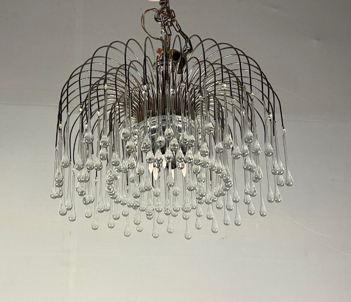 Pair of large chandeliers adorned with glass drops, chrome metal structures, Italy circa 1960.