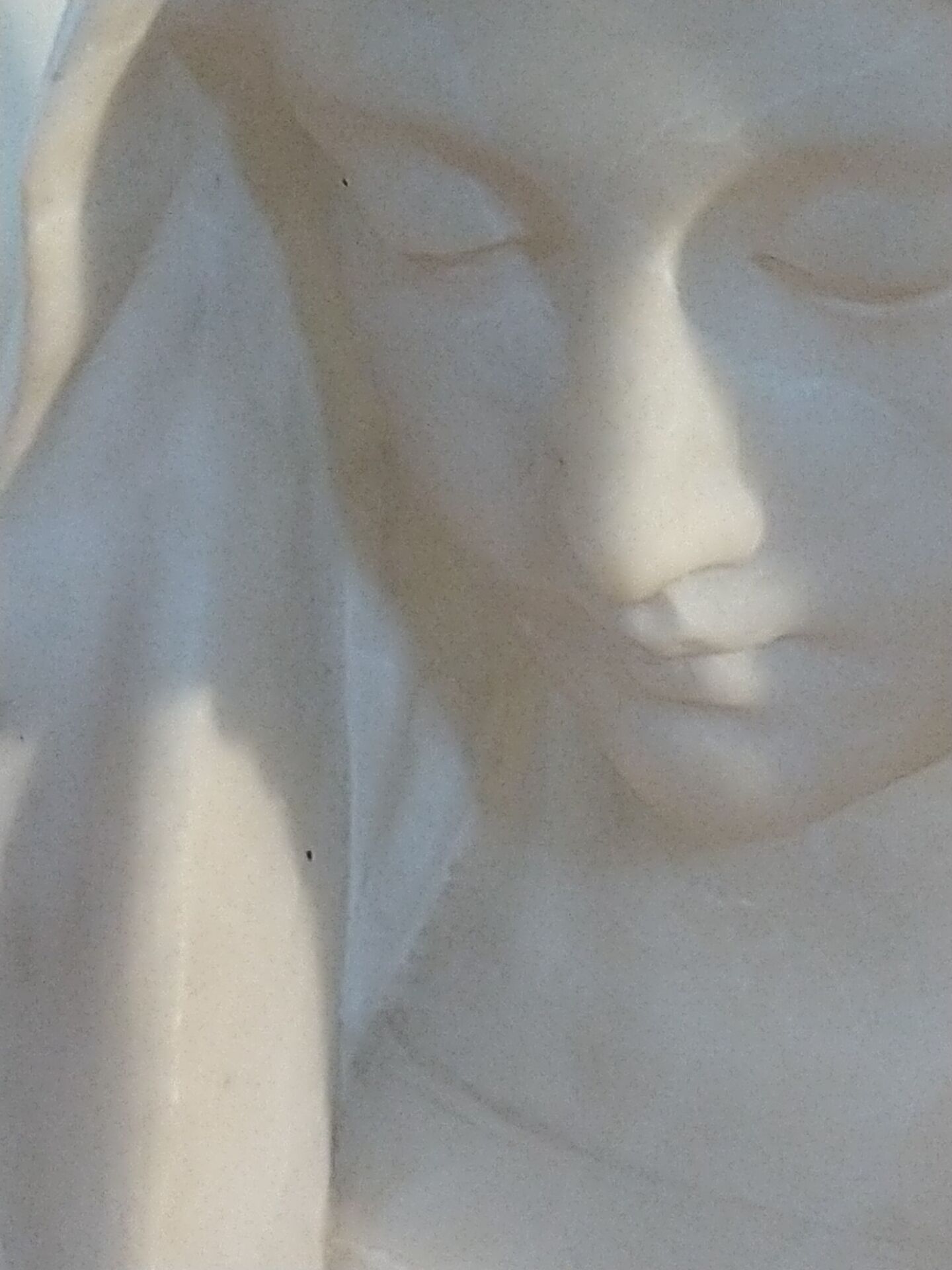 Bust of the Virgin in alabaster by Guglielmo Pugi.