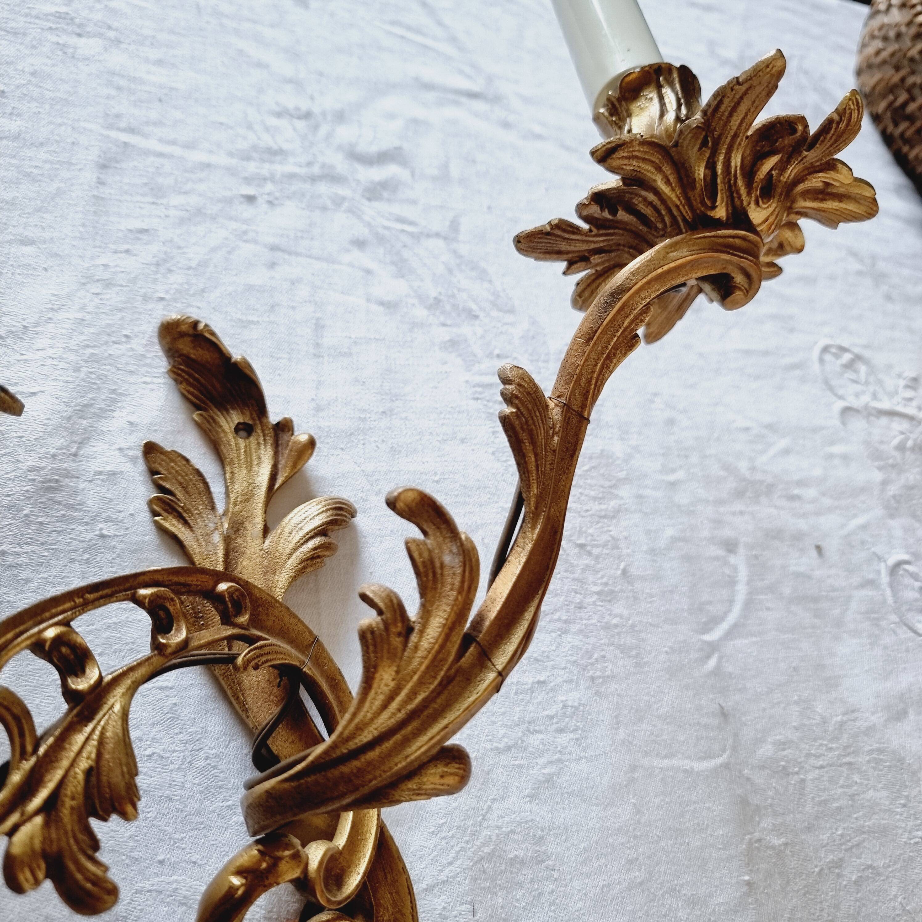 Pair of vintage French wall sconces in bronze, Louis XV Rococo style.
