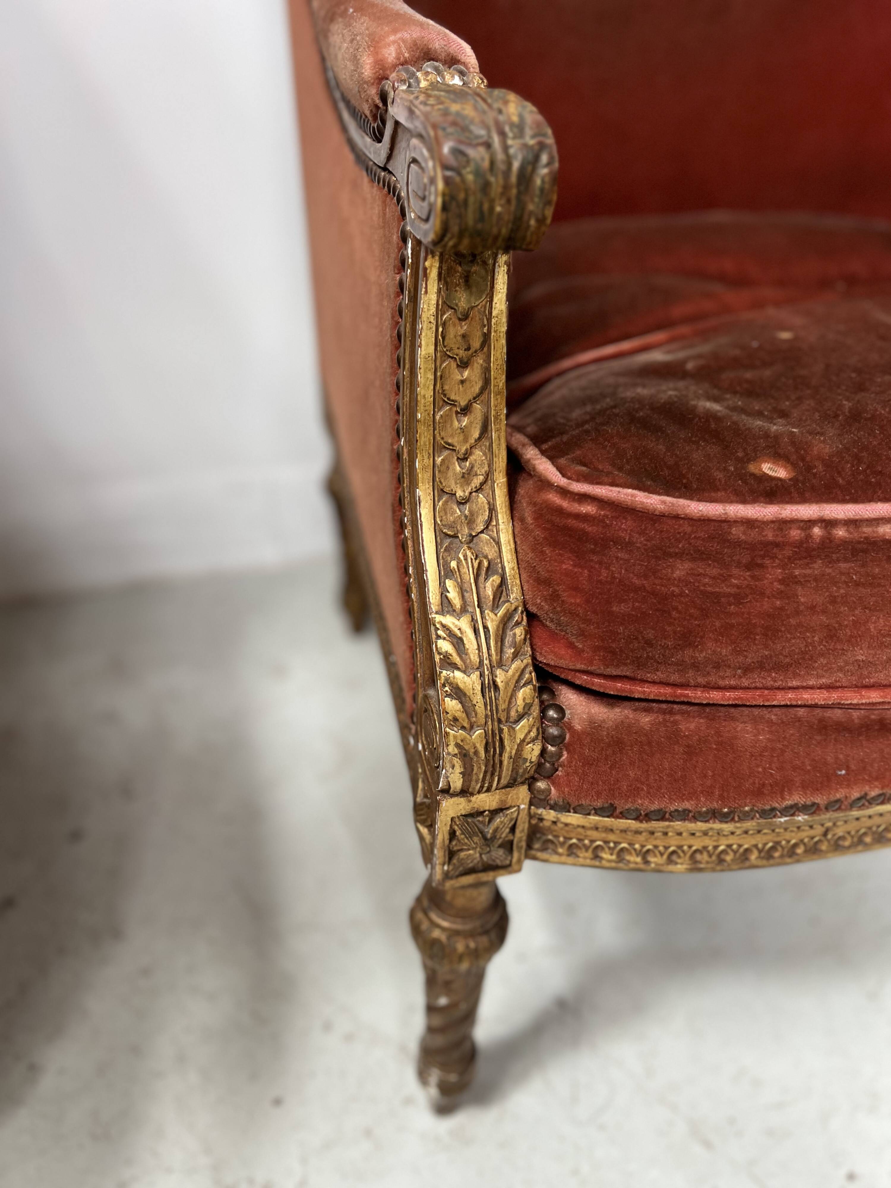 Two Louis XVI style wing chairs in gilded wood, 20th century