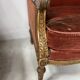 Two Louis XVI style wing chairs in gilded wood, 20th century