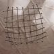Curved grid fruit bowl, chrome metal and beads.