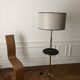 Tripod floor lamp with adjustable height and shelf from the 1960s.