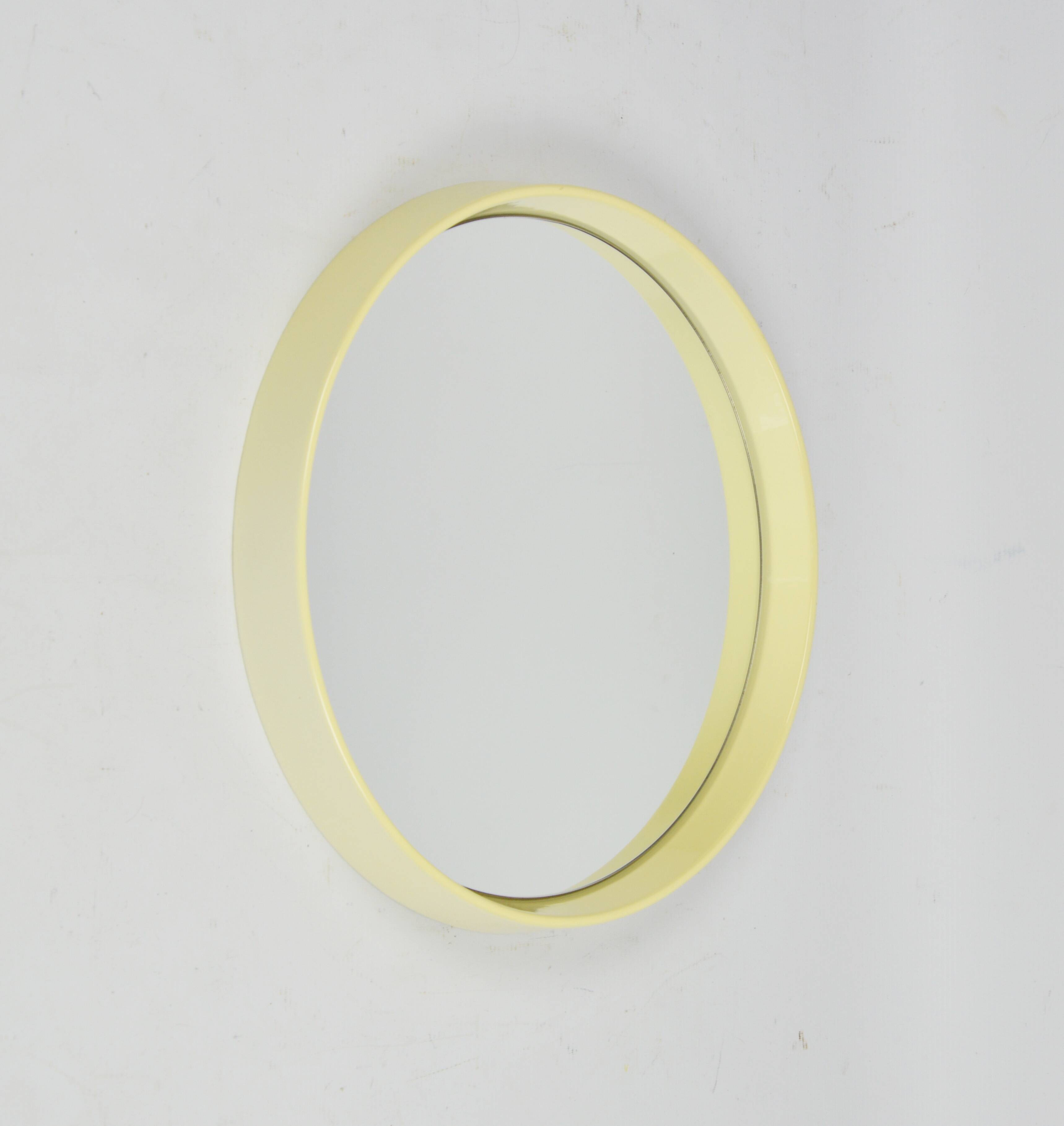 Round mirror in a deep frame, 1970s.