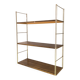 Golden wire shelf in metal with a wood effect.