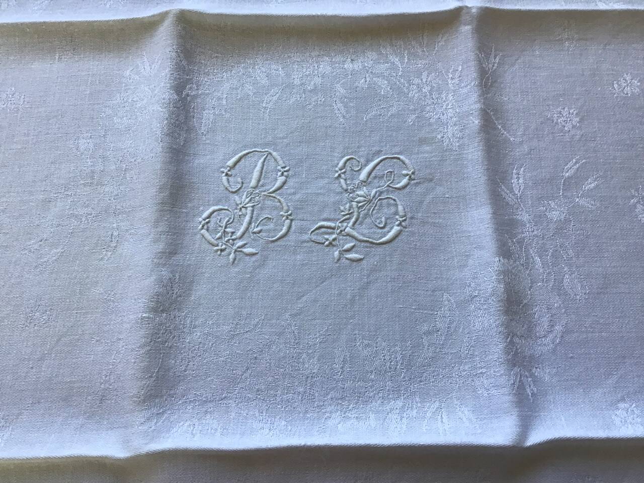Set of 12 19th century white napkins marked “BL”