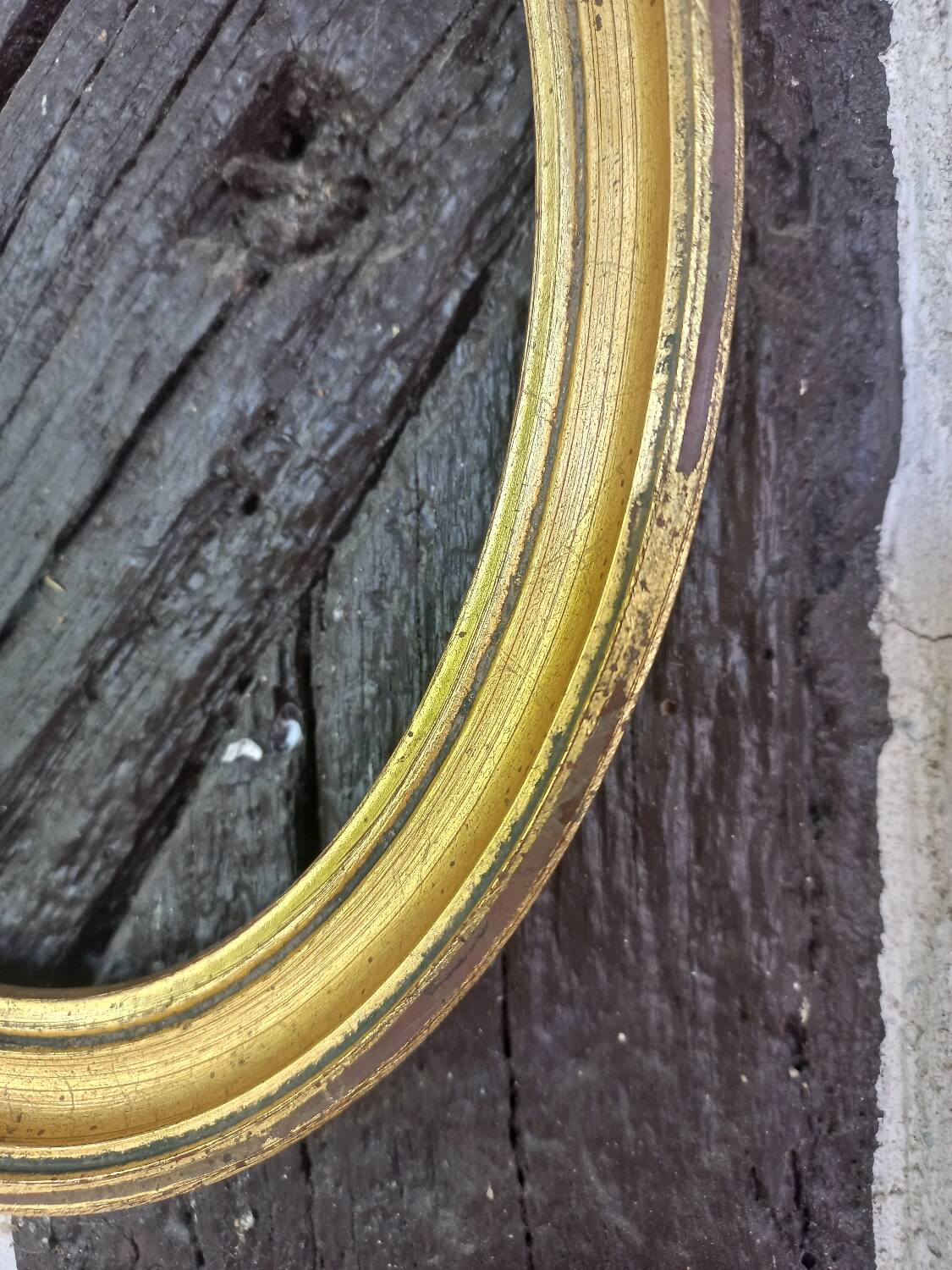 Golden oval frame