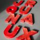 Lettres d'enseigne en zinc rouge formant le mot JOURNAUX