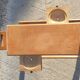 Magazine rack with sliding drawers in light wood, Scandinavian style.