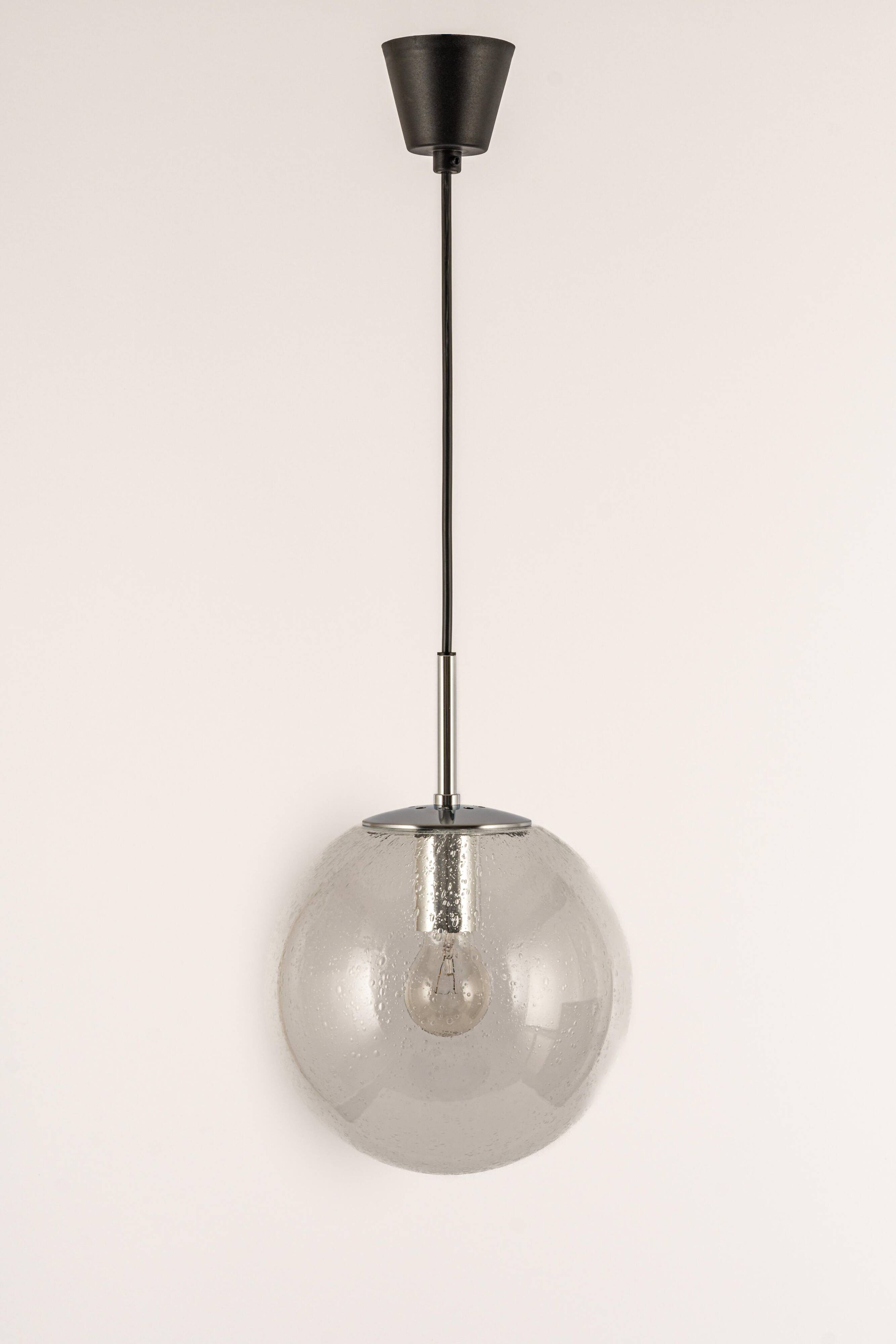 Small Limburg chrome pendant light with clear glass globe, Germany, 1970s.