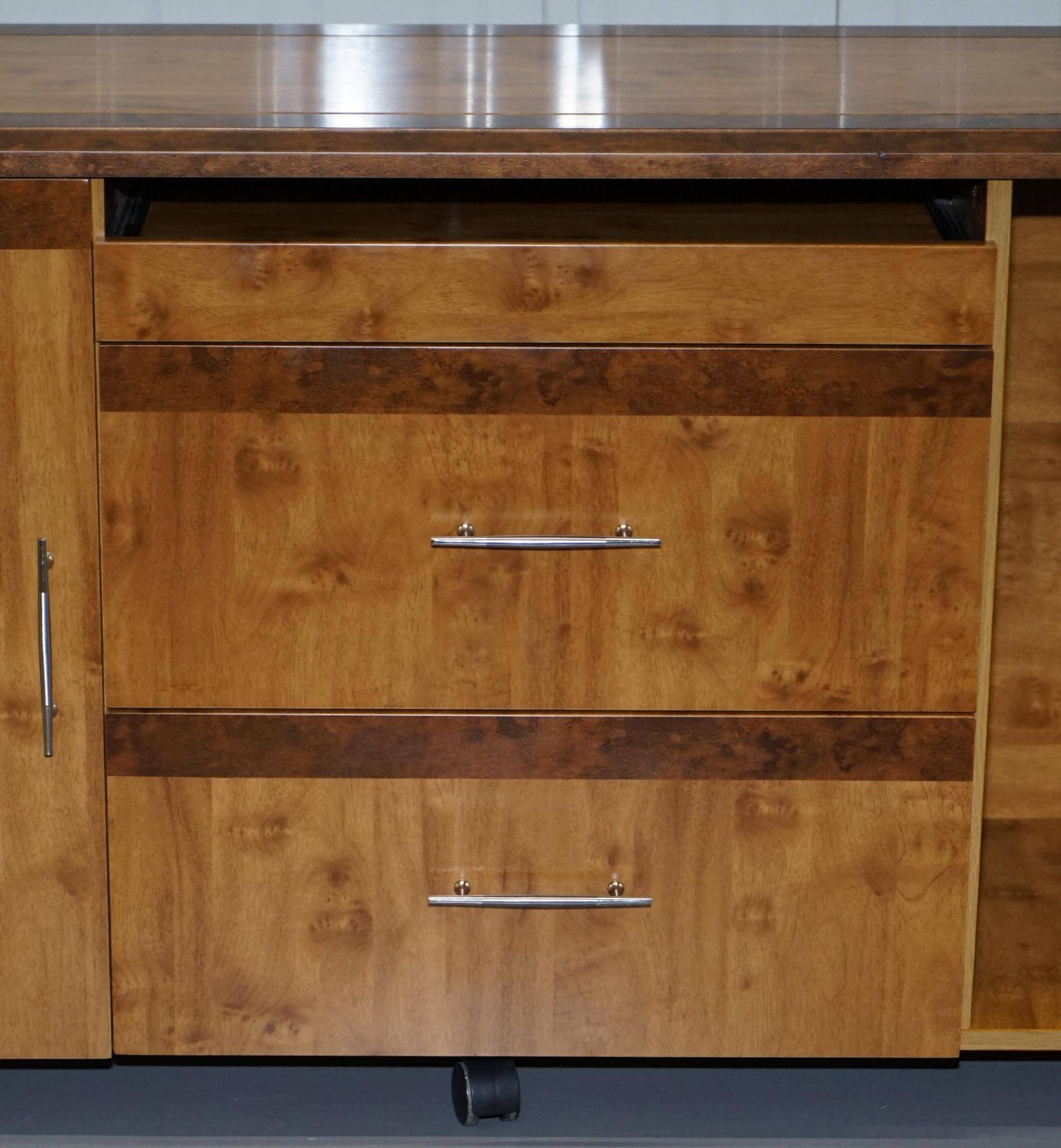 Walnut Burr buffet with drawers and wheels, part of a set.