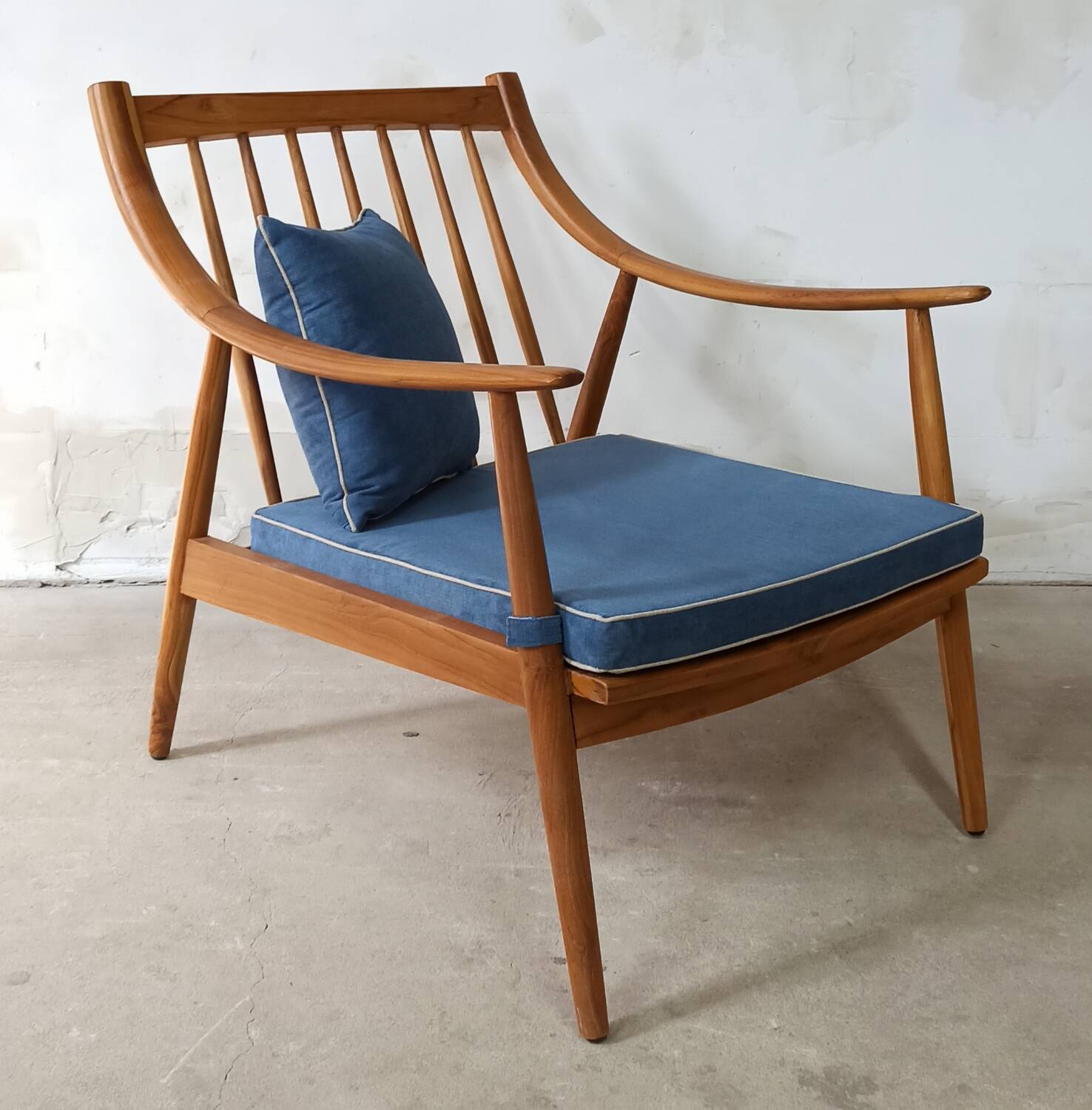 Pair of cozy teak armchairs with cushions