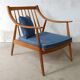 Pair of cozy teak armchairs with cushions
