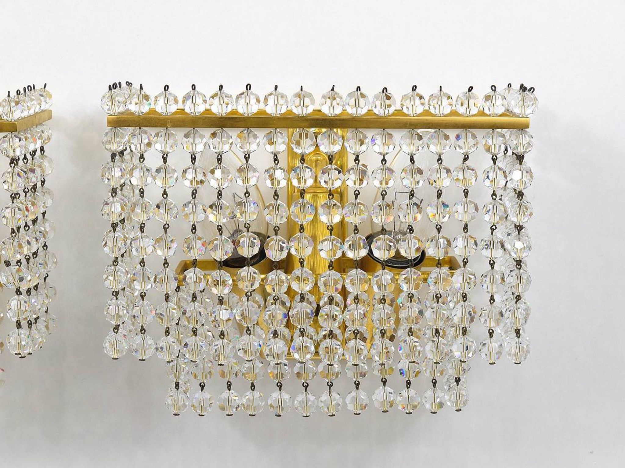 Pair of square wall sconces in gilded brass with hand-cut crystals, 1970s.