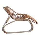 Elongated rattan armchair