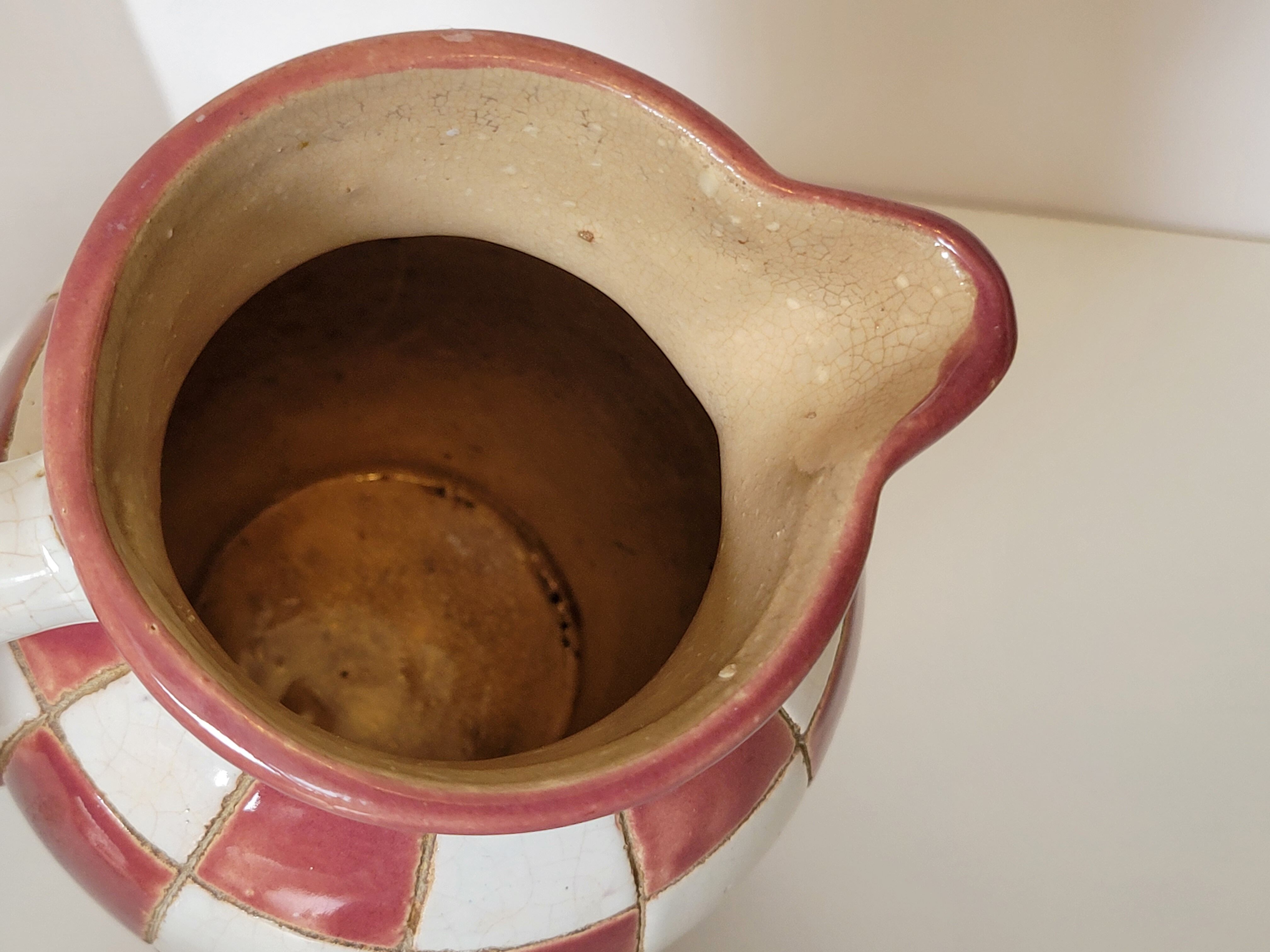Old ceramic pitcher pattern checkerboard tiles