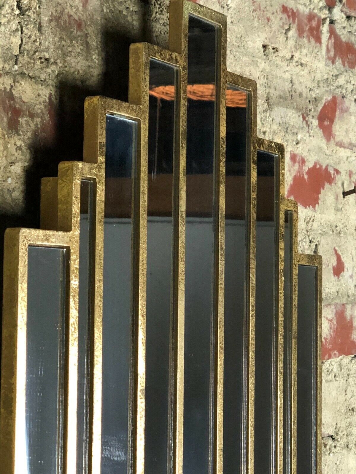 Art deco style "miami" mirror in patinated gilded wood 80x52cm