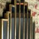Art deco style "miami" mirror in patinated gilded wood 80x52cm